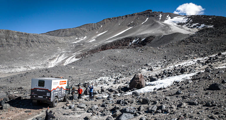 The engineering project team celebrates their altitude world record for electric trucks at 5950m